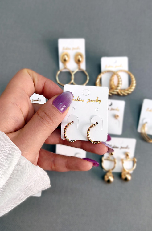 گوشواره زنانه حلقه ای طلایی بافت دار مدل پیچ